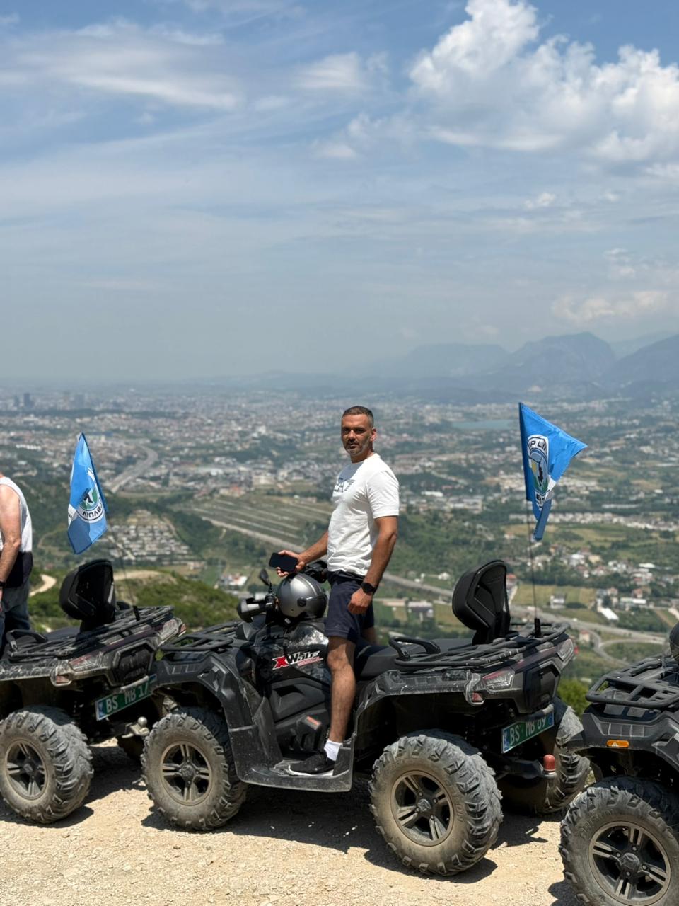 Rider posing on a quad above Tirana
